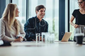 Business people smiling after a productive meeting