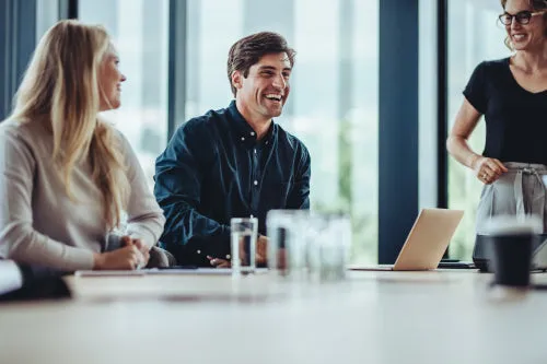 Business people smiling after a productive meeting