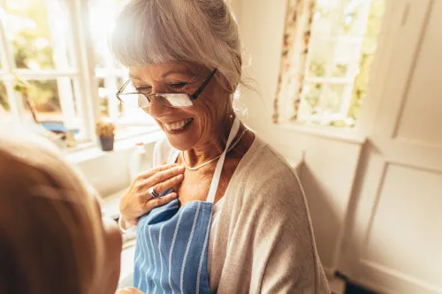 Close up of a senior woman in apron